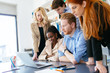 © NDABCREATIVITY - Designers working as a team in office