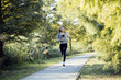 © NDABCREATIVITY - Fit beautiful woman jogging in park