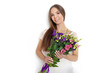 © Kaponia Aliaksei - Young cute woman holding bunch of flowers