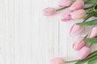beautiful tulips on wooden background