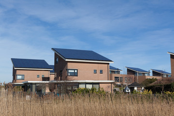 Wall Mural - Family house with solar panels for alternative energy