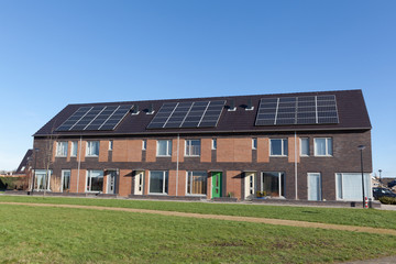 Wall Mural - Family house with solar panels for alternative energy