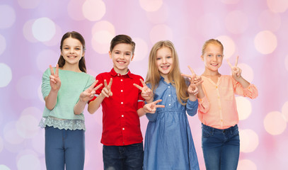 Sticker - happy boy and girls showing peace hand sign