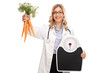 © Ljupco Smokovski - Female doctor holding carrots and a weight scale