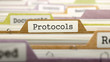 Protocols Concept on File Label in Multicolor Card Index. Closeup View. Selective Focus. 3D Render.