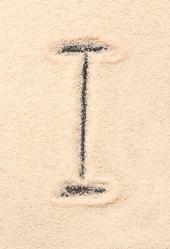 I letter written on sand