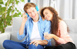 © Africa Studio - Teenager couple listening to music with mobile phone on a sofa
