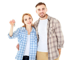 Wall Mural - Happy young couple with keys from new house isolated on white