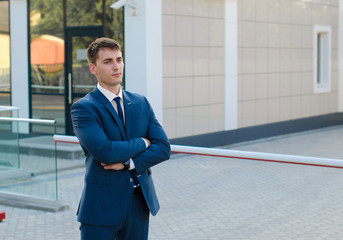 Businessman standing near building