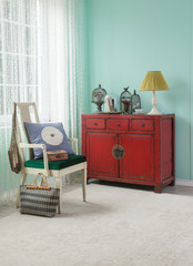 red cabinet asian living room with green wall