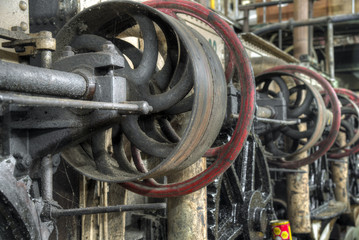 Wall Mural - Central shaft driven by belt in old colonial factory, Java, Indonesia