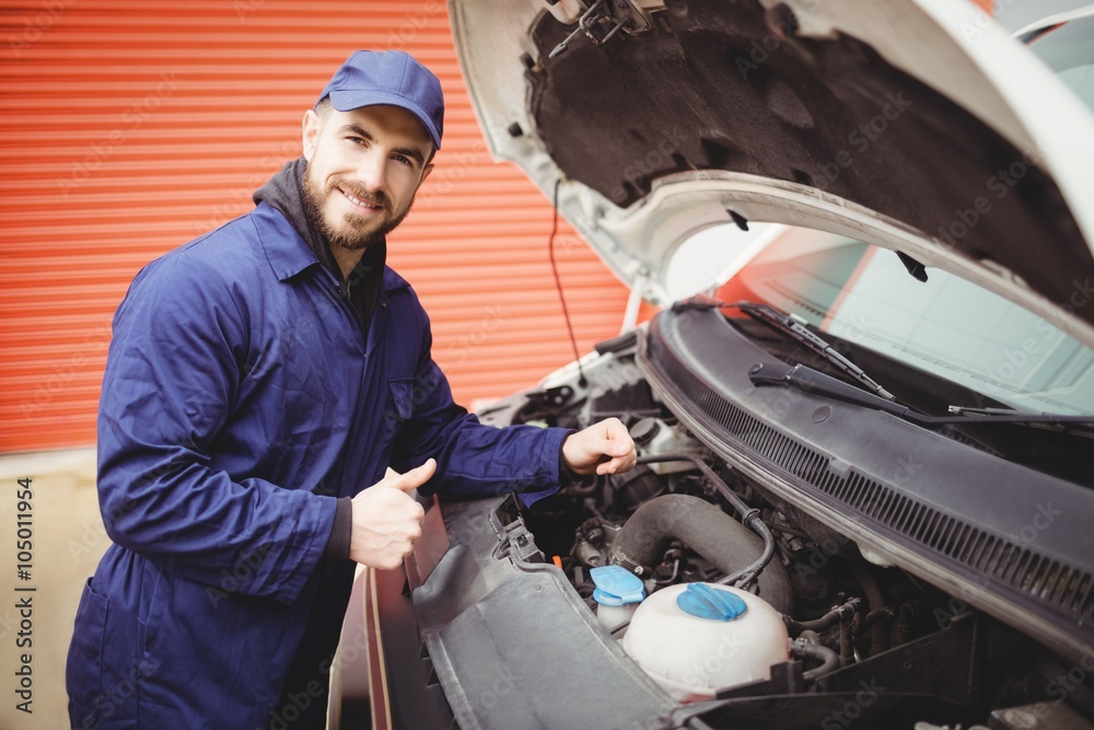 Mechanic fixing a van Stock Photo | Adobe Stock