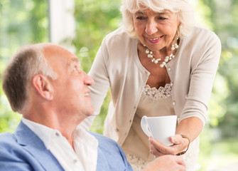 Wall Mural - Devoted wife serving coffee