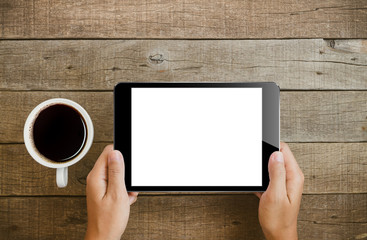 Wall Mural - hand holding tablet on wood table