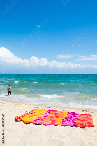Little child walking on the beach, beach vacation Poster