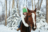 Fototapeta Konie - beautiful girl and horse in winter