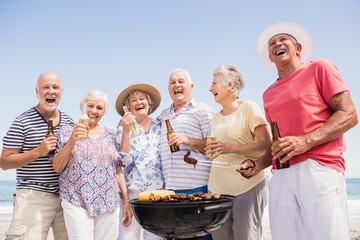 Wall Mural - Senior friends having a barbecue