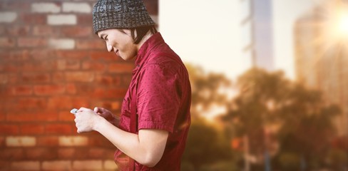 Poster - Composite image of smiling hipster businessman using phone