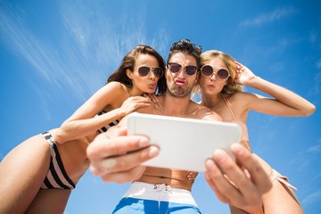 Poster - Happy friends taking selfie on the beach 