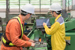 © ake1150 - Engineers and worker discussing work together in factory