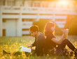 © torwaiphoto - Student was reading in the outdoors and good weather. And they'r