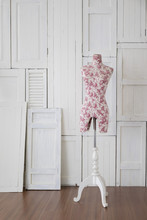 Mannequin With Vintage Pattern In The Room With White Wooden Window Wall