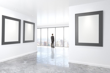 Poster - blank picture frames on white wall in empty loft room and busine