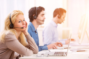  Young attractive woman working in a call center
