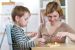 © Oksana Kuzmina - Child boy playing with education toys at the table in kindergarten