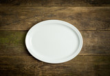 Fototapeta  - Empty white plate on rustic wooden background