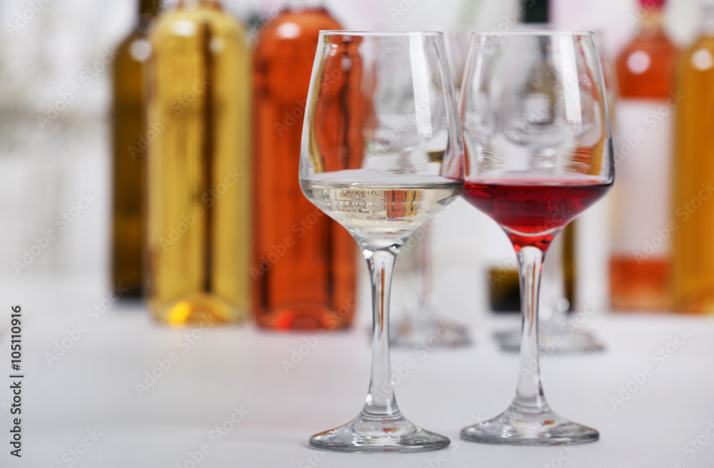 Wine glasses with red and white wine, closeup