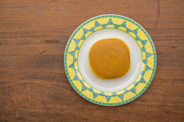 Piece of Dorayaki - delicious sweets of Japanese Traditional Dessert : Dorayaki in dish on wooden background