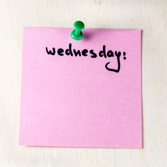 Wall Mural - Wednesday note on paper post it pinned to a wooden board