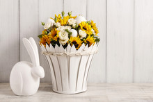 Bouquet Of White Roses And Sunflowers And Ceramic Rabbit