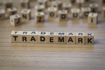 trademark written in wooden cubes