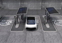 Electric Vehicle Charging Station In Public Space. The Charging Spot Support By Solar Panels, Storage Batteries.