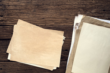 Wall Mural - empty old paper on wooden table - vintage background