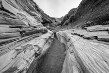 A Narrow Passage Between The Rocks. Black And White Photo. Mosaic Canyon, Death Valley National Park, Stovepipe Wells Area
