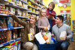 © JackF - Family buying groceries in supermarket