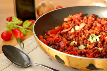 Cooked beans with pepper, potatoes and chilli