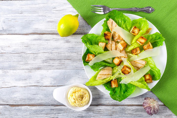 Canvas Print - classic Caesar salad, lettuce, croutons, parmesan cheese and chi