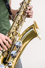 Wall Mural - saxophone in the hands of street musician