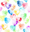 Watercolor hearts of rainbow colors on a white background in random order. Seamless pattern