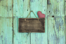 Blank Wood Sign With Red Heart Hanging On Rustic Wooden Door
