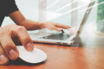 Aufkleber -  business man hand working on laptop computer on wooden desk as