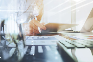 business documents on office table with laptop computer and grap