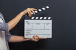 © VadimGuzhva - Handsome girl with clapperboard