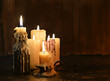 © samiramay - Group of candles burning in the darkness and copy space