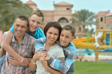 Poster - Family at tropical resort.