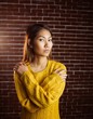 © WavebreakmediaMicro - Serious asian woman with hands on shoulders